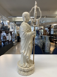 Three Chinese Dehua blanc de Chine figures of Guanyin and a monk, He Chaozong 何朝宗 and Dehua 德化 mark, 20th C.