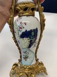 A pair of composed gilt bronze mounted Chinese famille rose 'tobacco leaf' vases, Qianlong