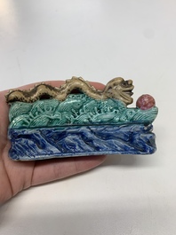 Six Chinese porcelain and glass brush rests, 19/20th C.