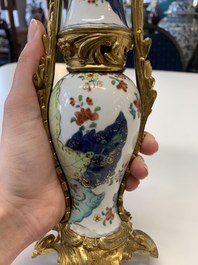 A pair of composed gilt bronze mounted Chinese famille rose 'tobacco leaf' vases, Qianlong