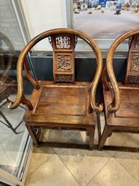 A pair of Chinese wooden 'horseshoe' chairs, 19/20th C.