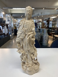 Three Chinese Dehua blanc de Chine figures of Guanyin and a monk, He Chaozong 何朝宗 and Dehua 德化 mark, 20th C.