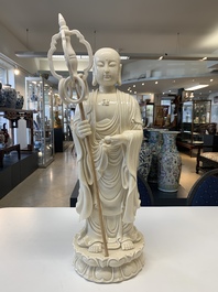 Three Chinese Dehua blanc de Chine figures of Guanyin and a monk, He Chaozong 何朝宗 and Dehua 德化 mark, 20th C.