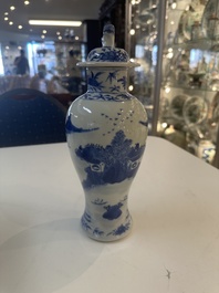 A Chinese blue and white garniture of five vases with river landscapes, 19th C.