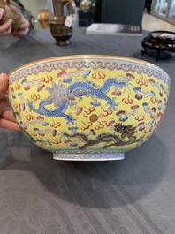 Two Chinese eggshell famille rose 'dragon' bowls on wooden stands, Qianlong mark, 20th C.