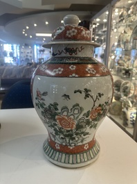 A Chinese famille verte vase and two covered vases, 19th C.