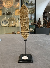 A Tibetan carved bone apron ornament with a dakini, 19th C.