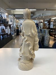 Three Chinese Dehua blanc de Chine figures of Guanyin and a monk, He Chaozong 何朝宗 and Dehua 德化 mark, 20th C.