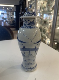 A Chinese blue and white garniture of five vases with river landscapes, 19th C.