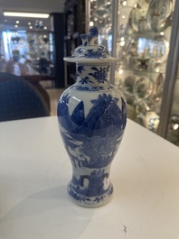 A Chinese blue and white garniture of five vases with river landscapes, 19th C.