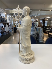 Three Chinese Dehua blanc de Chine figures of Guanyin and a monk, He Chaozong 何朝宗 and Dehua 德化 mark, 20th C.