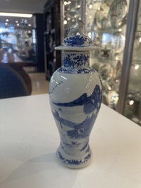 A Chinese blue and white garniture of five vases with river landscapes, 19th C.