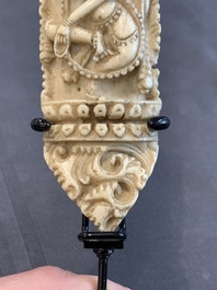 A Tibetan carved bone apron ornament with a dakini, 19th C.