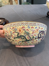 Two Chinese eggshell famille rose 'dragon' bowls on wooden stands, Qianlong mark, 20th C.