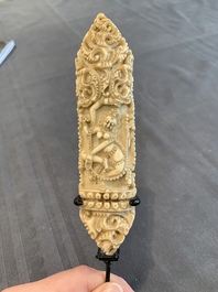 A Tibetan carved bone apron ornament with a dakini, 19th C.