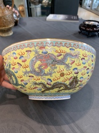 Two Chinese eggshell famille rose 'dragon' bowls on wooden stands, Qianlong mark, 20th C.
