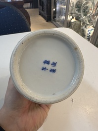A Chinese blue and white garniture of five vases with river landscapes, 19th C.