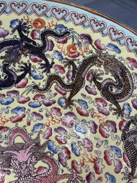Two Chinese eggshell famille rose 'dragon' bowls on wooden stands, Qianlong mark, 20th C.