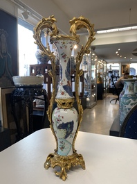 A pair of composed gilt bronze mounted Chinese famille rose 'tobacco leaf' vases, Qianlong