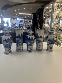 A Chinese blue and white garniture of five vases with river landscapes, 19th C.