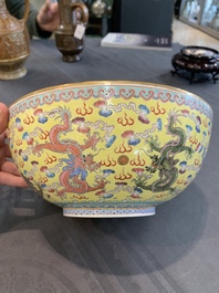 Two Chinese eggshell famille rose 'dragon' bowls on wooden stands, Qianlong mark, 20th C.