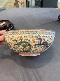 Two Chinese eggshell famille rose 'dragon' bowls on wooden stands, Qianlong mark, 20th C.