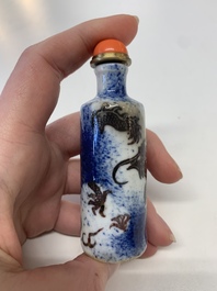 Four Chinese blue, white and copper-red snuff bottles, Yongzheng mark, 19th C.