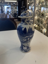 A Chinese blue and white garniture of five vases with river landscapes, 19th C.