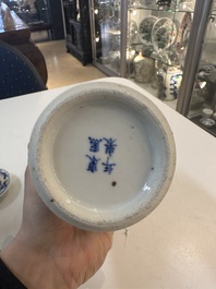 A Chinese blue and white garniture of five vases with river landscapes, 19th C.