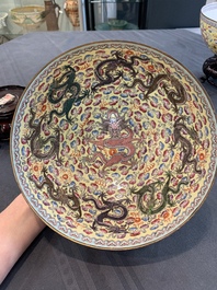 Two Chinese eggshell famille rose 'dragon' bowls on wooden stands, Qianlong mark, 20th C.