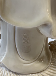Three Chinese Dehua blanc de Chine figures of Guanyin and a monk, He Chaozong 何朝宗 and Dehua 德化 mark, 20th C.