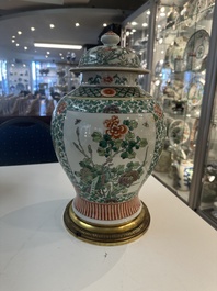 A Chinese famille verte vase and two covered vases, 19th C.