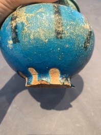 A fine Raqqa turquoise-glazed striped jar, Syria, 13th C.