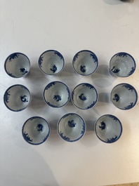 11 Japanese blue and white cups and 12 saucers with floral design, Chenghua mark, Meiji, 19th C.