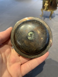A rare and fine Chinese partly-gilt copper chocolate pot with tripod stand, 18th C.
