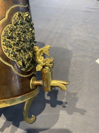 A rare and fine Chinese partly-gilt copper chocolate pot with tripod stand, 18th C.