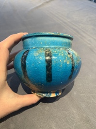 A fine Raqqa turquoise-glazed striped jar, Syria, 13th C.
