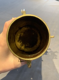 A rare and fine Chinese partly-gilt copper chocolate pot with tripod stand, 18th C.