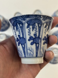 11 Japanese blue and white cups and 12 saucers with floral design, Chenghua mark, Meiji, 19th C.
