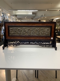 A Chinese wooden table screen with a carved stone 'dragon' plaque, 20th C.