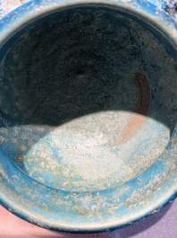 A fine Raqqa turquoise-glazed striped jar, Syria, 13th C.