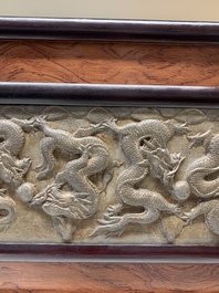 A Chinese wooden table screen with a carved stone 'dragon' plaque, 20th C.