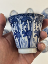 11 Japanese blue and white cups and 12 saucers with floral design, Chenghua mark, Meiji, 19th C.