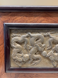 A Chinese wooden table screen with a carved stone 'dragon' plaque, 20th C.