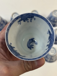 11 Japanese blue and white cups and 12 saucers with floral design, Chenghua mark, Meiji, 19th C.
