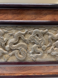 A Chinese wooden table screen with a carved stone 'dragon' plaque, 20th C.