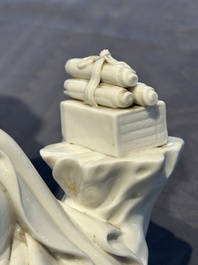 A Chinese Dehua blanc de Chine figure of a seated Guanyin on wooden stand, 19/20th C.