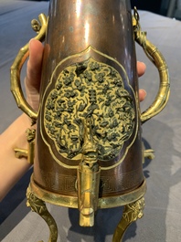 A rare and fine Chinese partly-gilt copper chocolate pot with tripod stand, 18th C.