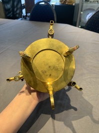 A rare and fine Chinese partly-gilt copper chocolate pot with tripod stand, 18th C.