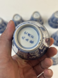 11 Japanese blue and white cups and 12 saucers with floral design, Chenghua mark, Meiji, 19th C.